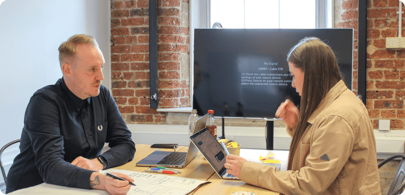Two people collaborating in a meeting